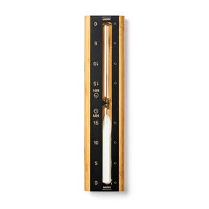 Gold and black hourglass timer with white sand on a white background